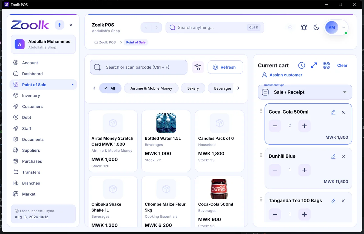 Zoolk POS checkout: product catalog with categories on the left and a live cart on the right